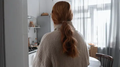 Dog in kitchen with owner