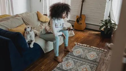 Dog resting beside an owner